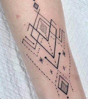 Fine line geometric tattoo reference with abstract lines and dotwork on an arm
